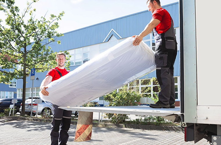 professionals moving mattress